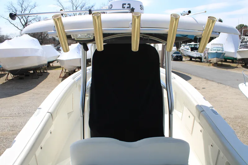 Slide: The Image of 2007 Hydra-Sports Vector 2900 CC boat with rod holders, docked outdoors. - 17