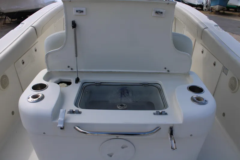 Slide: The Image of 2007 Hydra-Sports Vector 2900 CC boat interior with open storage compartment and cup holders. - 7