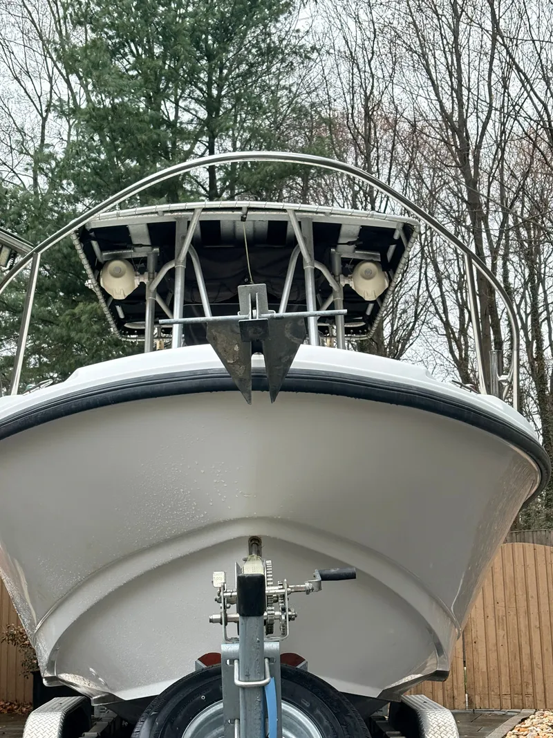 Slide: The Image of 1999 Boston Whaler 230 Outrage boat on trailer, front view. - 2