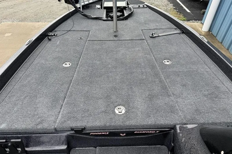 Slide: The Image of 2026 Phoenix 721 ZXL boat deck with gray carpet and storage compartments. - 11