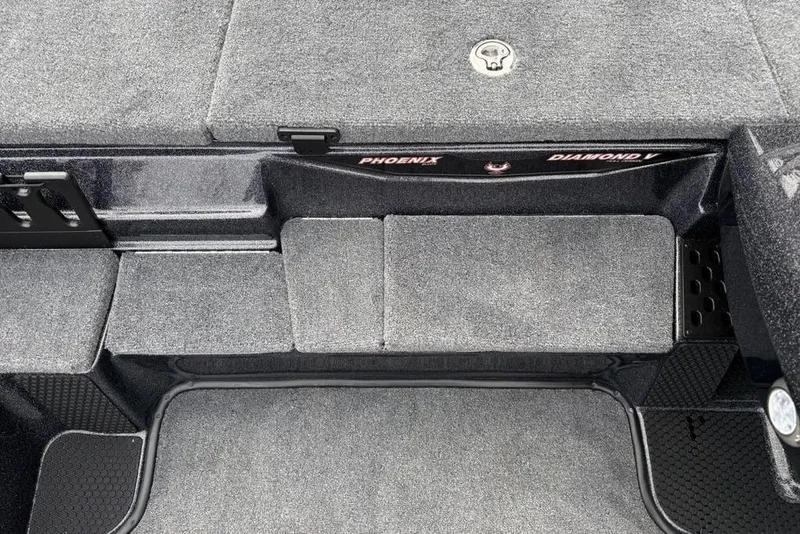 Slide: The Image of 2026 Phoenix 721 ZXL boat interior with gray carpet and storage compartments. - 12