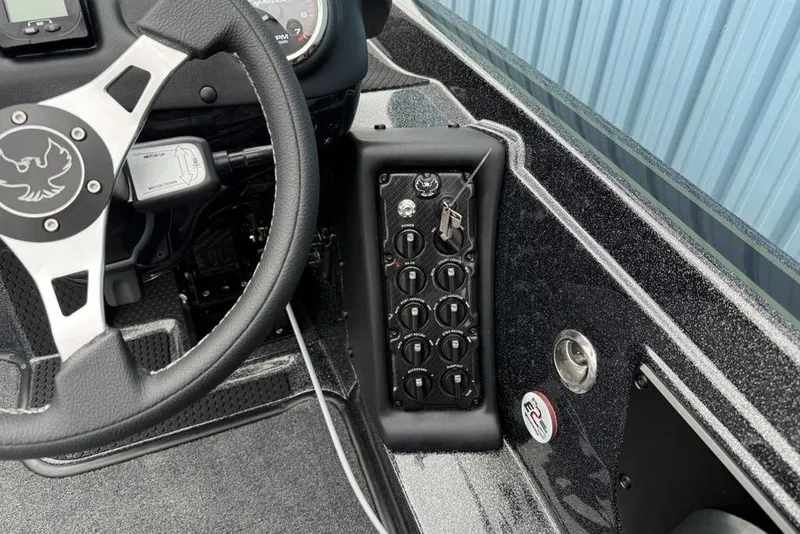 Slide: The Image of Steering wheel and control panel of 2026 Phoenix 721 ZXL boat interior. - 18