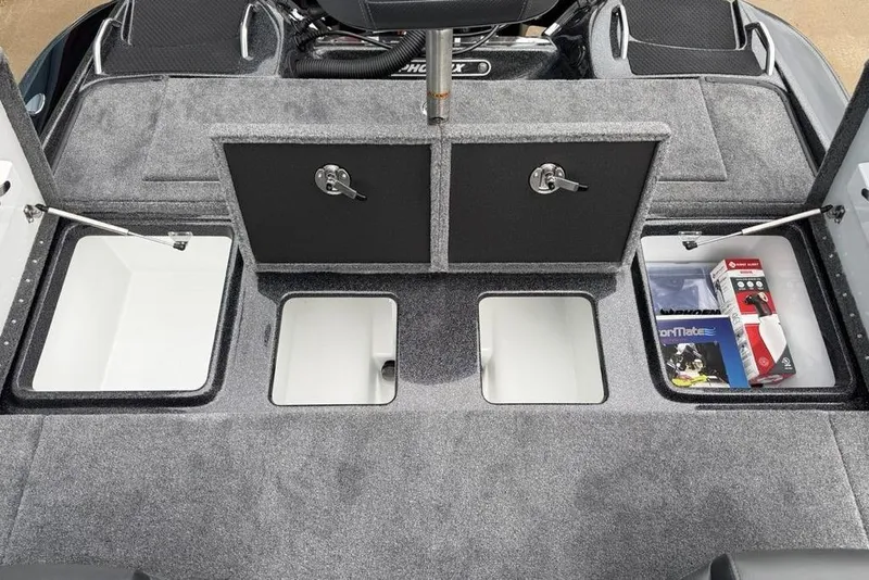 Slide: The Image of Interior storage compartments of 2026 Phoenix 721 ZXL boat, featuring organized spaces and accessories. - 24