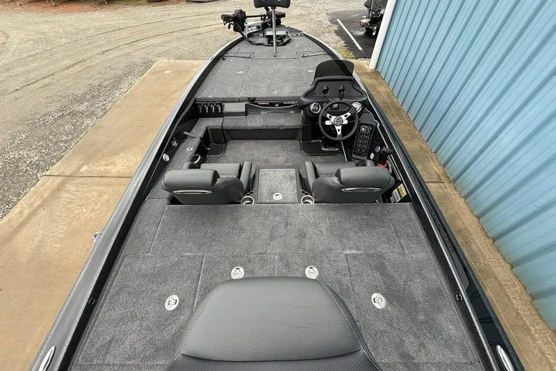 Slide: The Image of 2026 Phoenix 721 ZXL boat interior with gray carpet and dual seating. - 26