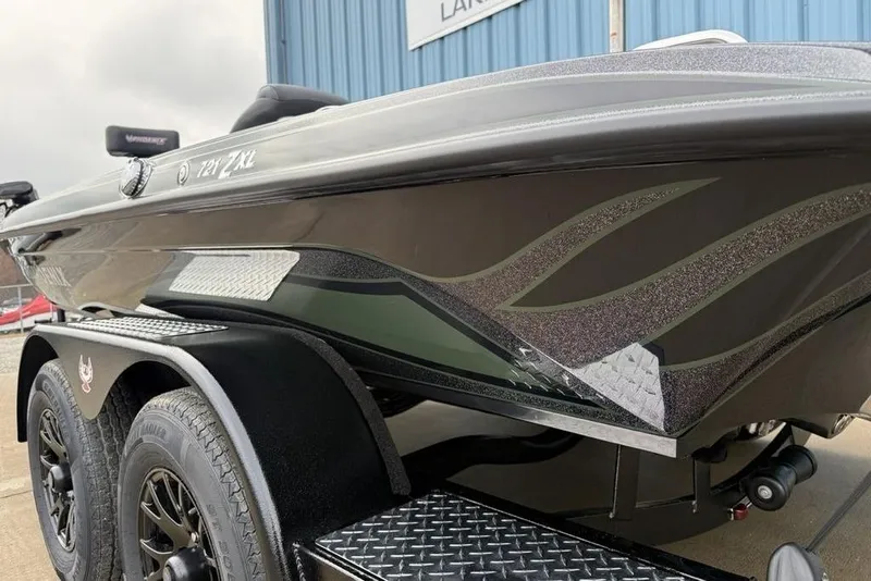 Slide: The Image of 2026 Phoenix 721 ZXL boat on trailer, sleek design with custom graphics. - 3