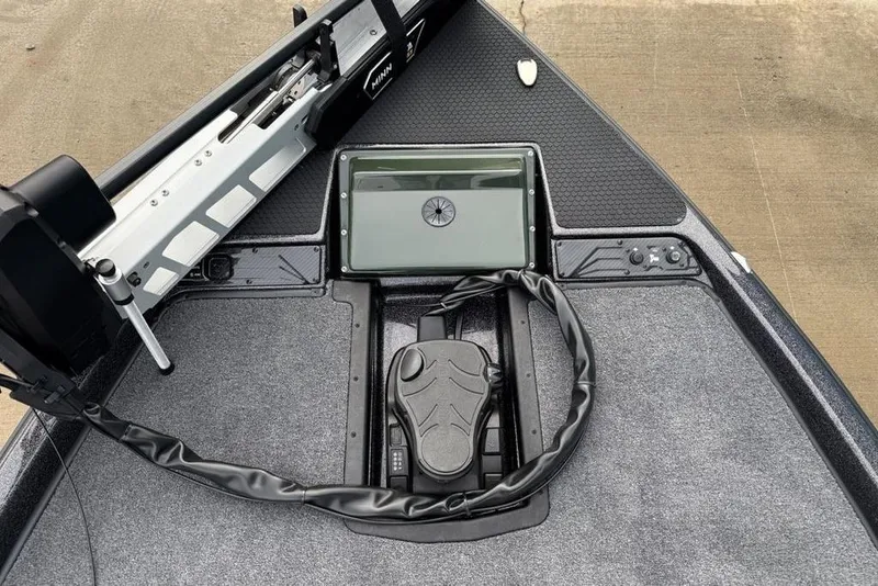 Slide: The Image of Front deck of 2026 Phoenix 721 ZXL boat with trolling motor and control panel. - 7