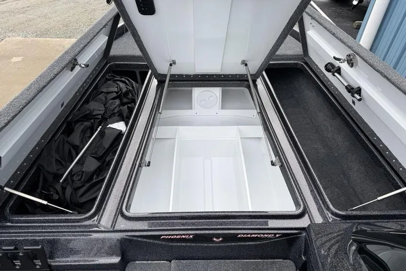 Slide: The Image of Open storage compartment of 2026 Phoenix 721 ZXL boat, showcasing spacious interior design. - 8