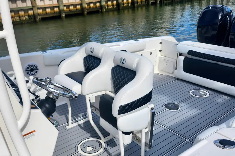 Slide: The Image of 2014 Wellcraft 35 Scarab Sport boat interior with stylish seating and steering wheel. - 12