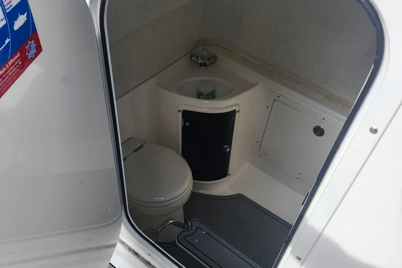 Slide: The Image of Interior of 2014 Wellcraft 35 Scarab Sport boat bathroom with toilet and sink. - 8