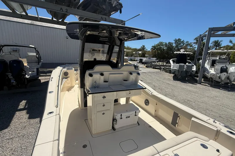 Slide: The Image of 2026 Scout 288 LXF boat interior with helm station and seating area. - 13