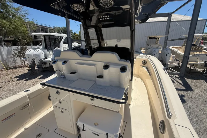Slide: The Image of 2026 Scout 288 LXF boat interior with seating and storage compartments. - 18