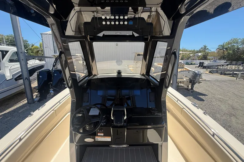 Slide: The Image of 2026 Scout 288 LXF boat cockpit with modern controls and steering wheel. - 20