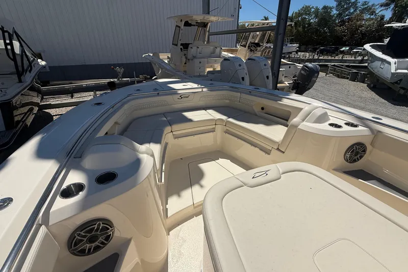 Slide: The Image of 2026 Scout 288 LXF boat interior with seating and cup holders. - 28