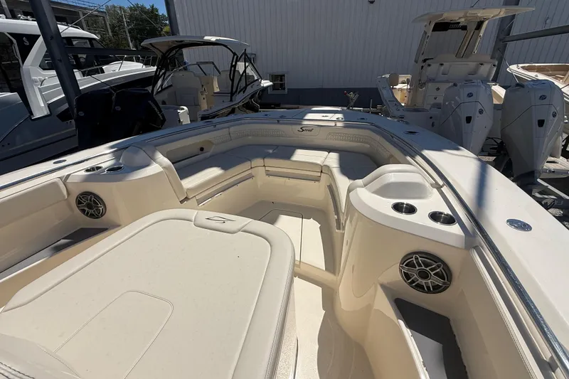 Slide: The Image of 2026 Scout 288 LXF boat interior with seating and cup holders. - 31