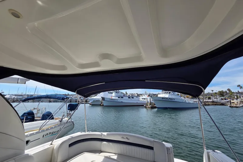 Slide: The Image of 2007 Sea Ray 40 Sundancer yacht interior with marina view, featuring boats and clear skies. - 15