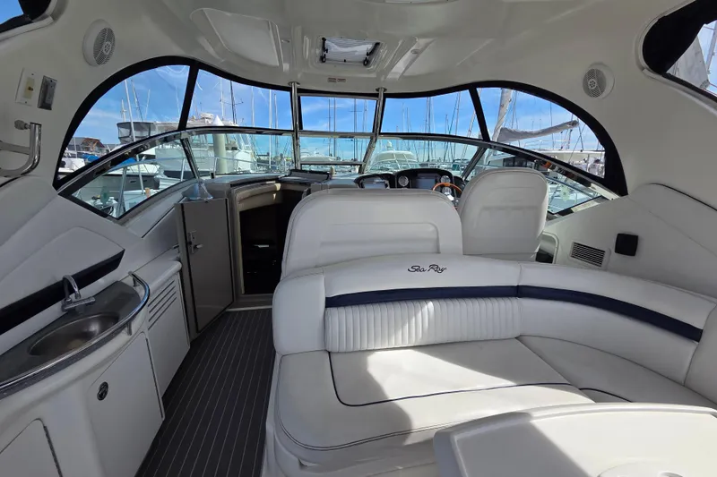 Slide: The Image of Interior of a 2007 Sea Ray 40 Sundancer yacht with plush seating and modern amenities. - 16