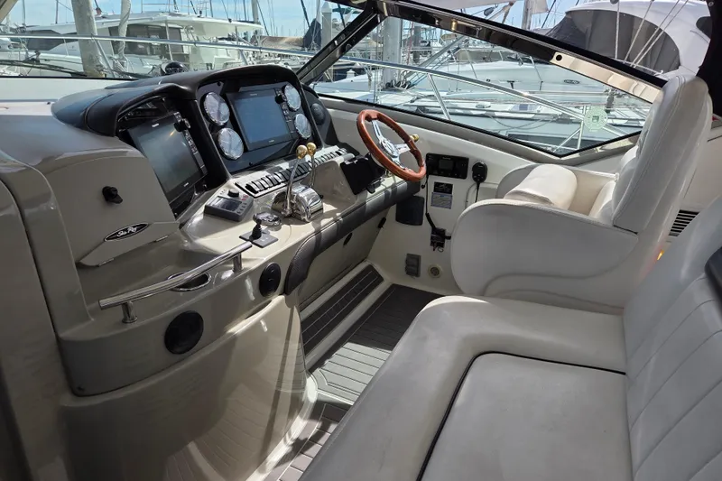 Slide: The Image of 2007 Sea Ray 40 Sundancer helm with modern controls and luxurious seating. - 19