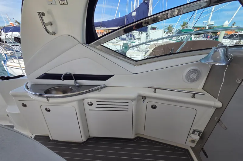 Slide: The Image of 2007 Sea Ray 40 Sundancer yacht interior with sink and storage cabinets. - 21