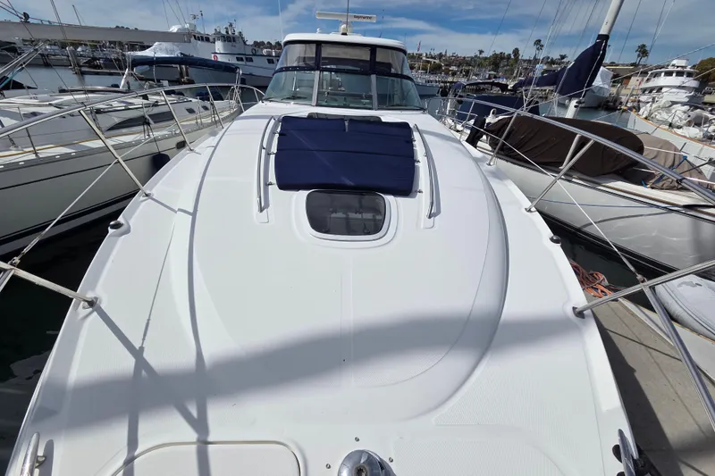Slide: The Image of 2007 Sea Ray 40 Sundancer yacht docked at marina, showcasing sleek deck design. - 22