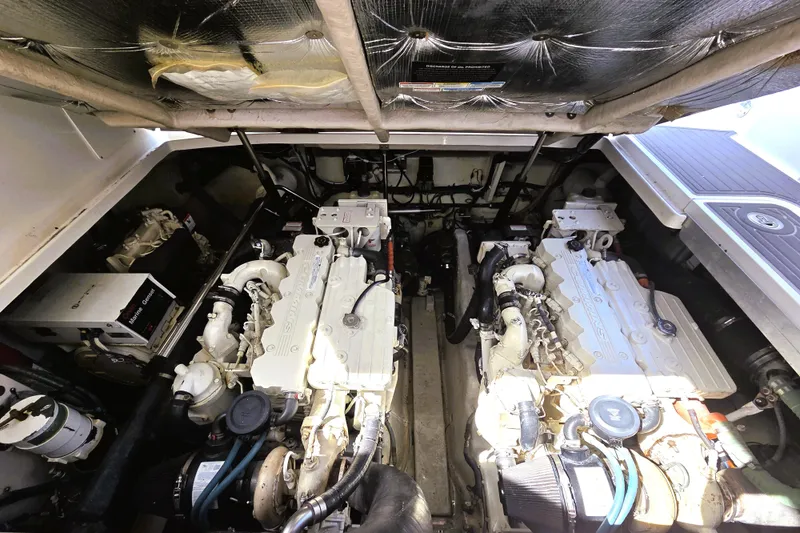 Slide: The Image of Engine room of a 2007 Sea Ray 40 Sundancer with twin engines and equipment. - 23