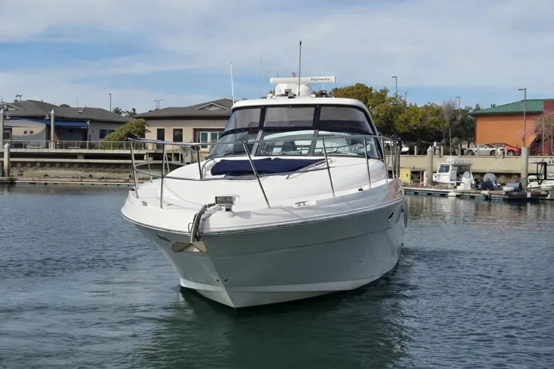 Slide: The Image of 2007 Sea Ray 40 Sundancer yacht docked in a marina, front view. - 3