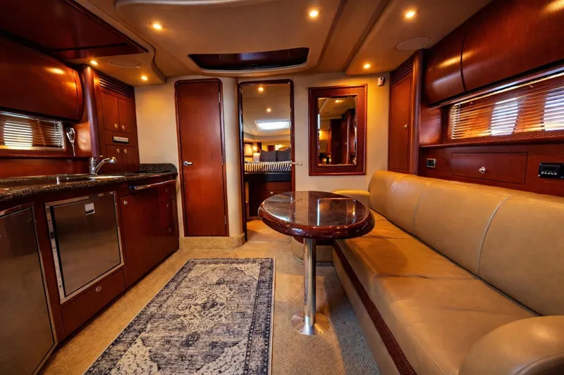 Slide: The Image of Luxurious interior of 2007 Sea Ray 40 Sundancer yacht with elegant wood finishes and cozy seating. - 4