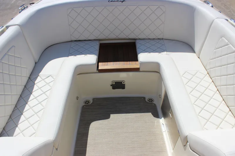 Slide: The Image of Luxurious seating area on 2024 Chris-Craft Launch 27 boat with quilted upholstery. - 16