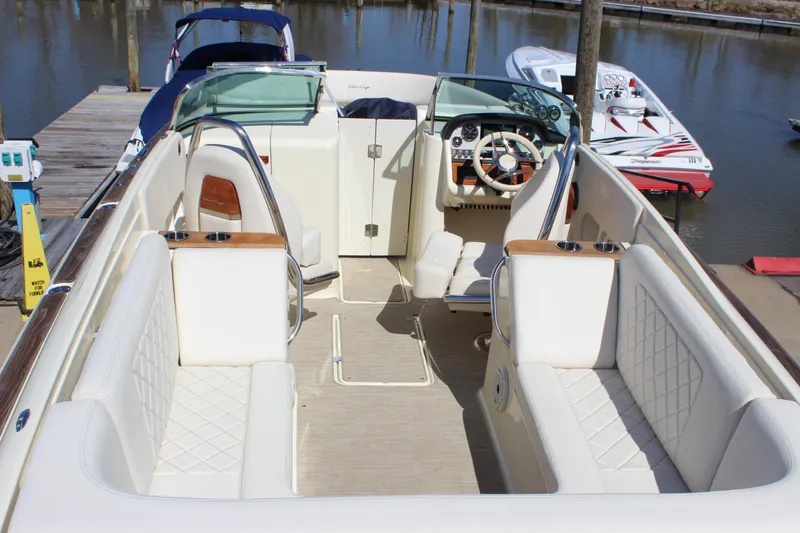 Slide: The Image of 2024 Chris-Craft Launch 27 boat interior with luxurious seating and elegant dashboard. - 21