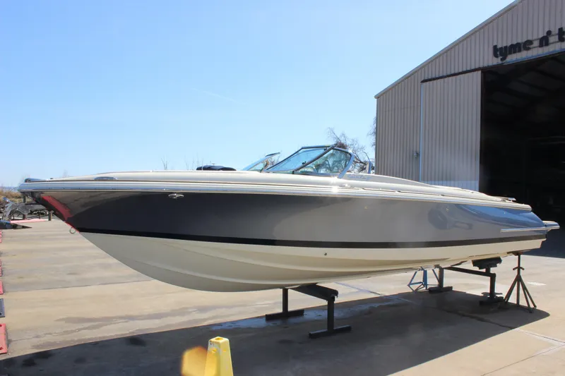 Slide: The Image of 2024 Chris-Craft Launch 27 boat on display outside a warehouse. - 3