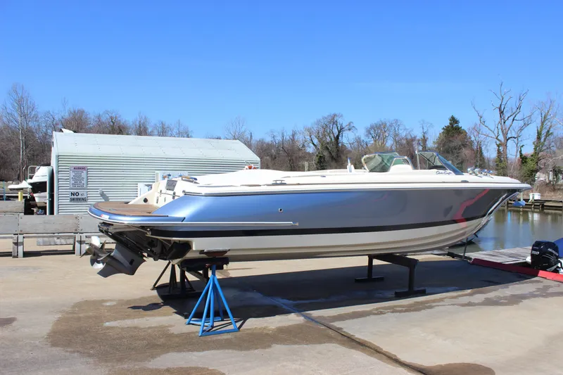 Slide: The Image of 2024 Chris-Craft Launch 27 boat on display at a marina, clear blue sky background. - 6