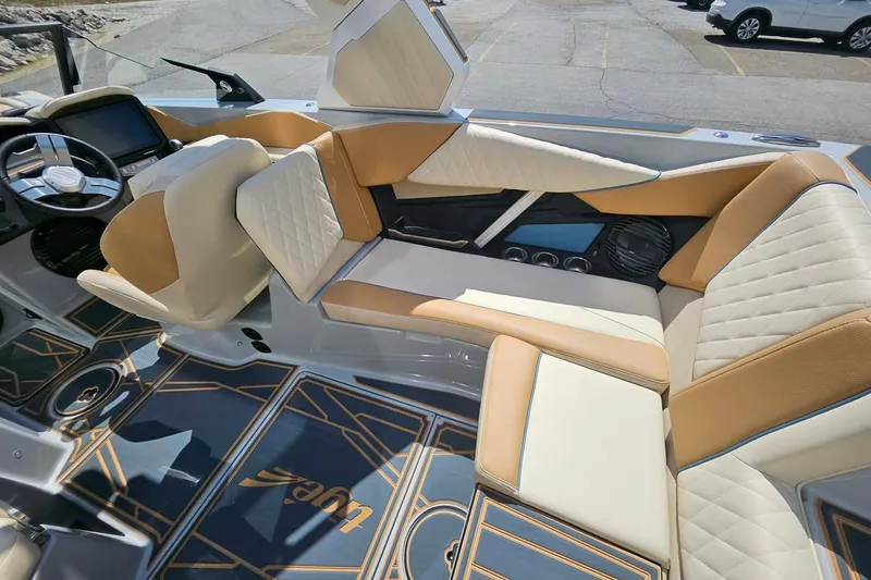 Slide: The Image of 2026 Tigé Z3 boat interior with luxurious tan and white seating, modern dashboard. - 14