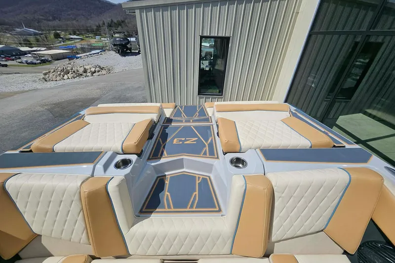 Slide: The Image of 2026 Tigé Z3 boat with luxurious seating and modern design, parked outdoors. - 17