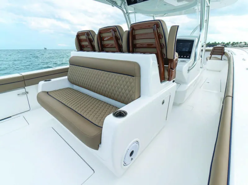 Slide: The Image of 2026 Valhalla Boatworks V-41 interior with luxurious seating and ocean backdrop. - 10