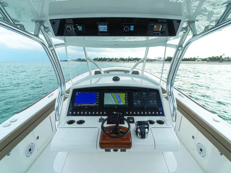 Slide: The Image of 2026 Valhalla Boatworks V-41 helm with advanced navigation displays on open water. - 14