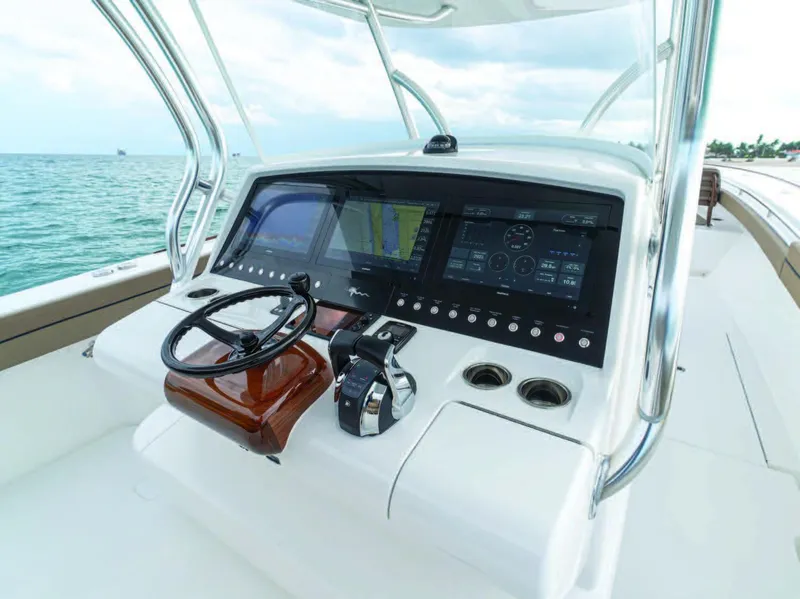 Slide: The Image of 2026 Valhalla Boatworks V-41 helm with advanced navigation displays and controls. - 15