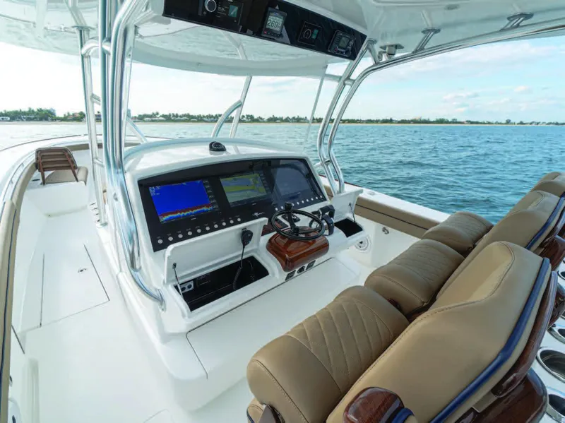 Slide: The Image of 2026 Valhalla Boatworks V-41 helm with advanced navigation systems on open water. - 17