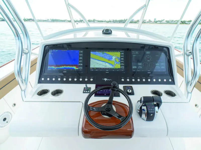 Slide: The Image of 2026 Valhalla Boatworks V-41 helm with advanced navigation displays and controls. - 19