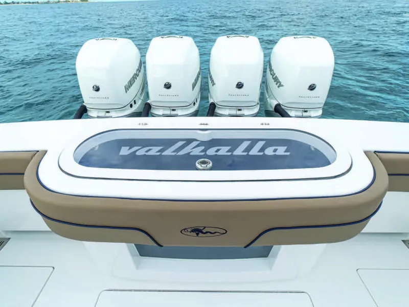 Slide: The Image of 2026 Valhalla Boatworks V-41 with four Mercury outboard engines on open water. - 2