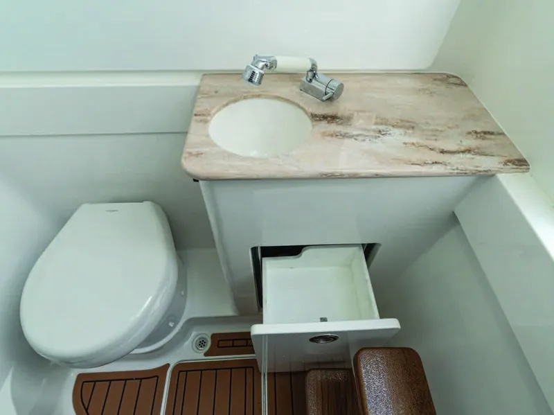 Slide: The Image of 2026 Valhalla Boatworks V-41 bathroom with sink, toilet, and storage drawer. - 28