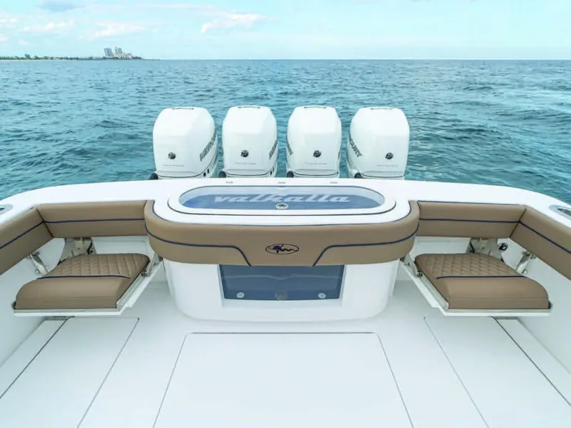 Slide: The Image of 2026 Valhalla Boatworks V-41 with quad engines, spacious deck, and ocean backdrop. - 3