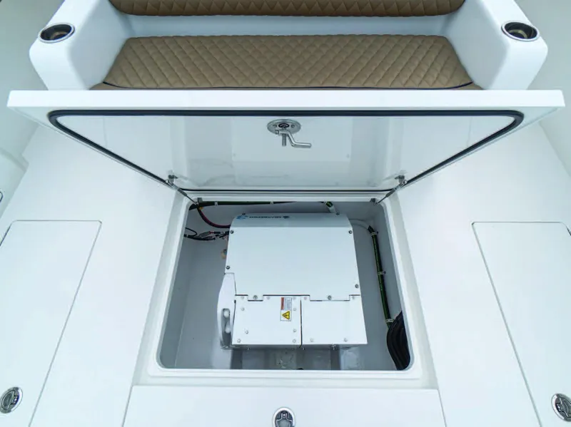 Slide: The Image of 2026 Valhalla Boatworks V-41 storage compartment with open hatch, revealing interior equipment. - 8