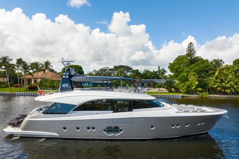 Slide: The Image of 2015 Monte Carlo Yachts MCY 86 luxury yacht cruising on a scenic waterway. - 10