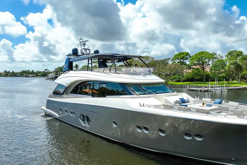 Slide: The Image of Luxurious 2015 Monte Carlo Yachts MCY 86 cruising on a scenic waterway. - 15