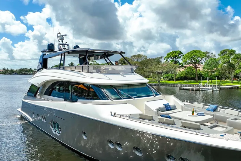 Slide: The Image of Luxurious 2015 Monte Carlo Yachts MCY 86 cruising on a scenic waterway. - 16