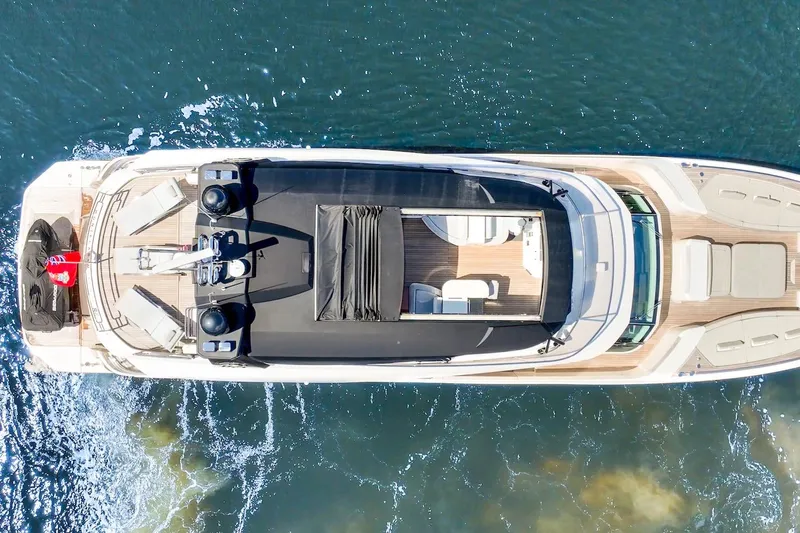 Slide: The Image of Aerial view of 2015 Monte Carlo Yachts MCY 86 luxury yacht cruising on water. - 2