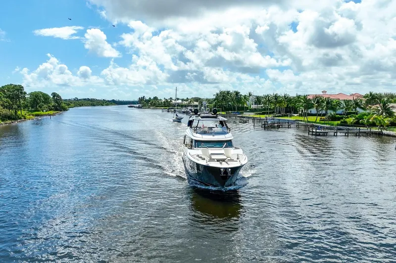 Slide: The Image of Luxurious 2015 Monte Carlo Yachts MCY 86 cruising on a scenic waterway. - 20