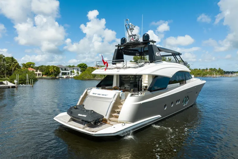Slide: The Image of Luxurious 2015 Monte Carlo Yachts MCY 86 cruising on a scenic waterway. - 3