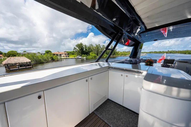 Slide: The Image of Luxurious 2015 Monte Carlo Yachts MCY 86 deck with scenic waterfront view. - 43