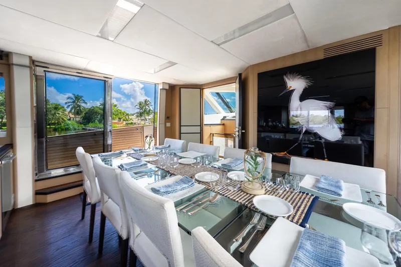 Slide: The Image of Luxurious dining area on 2015 Monte Carlo Yachts MCY 86 with elegant table setting. - 49