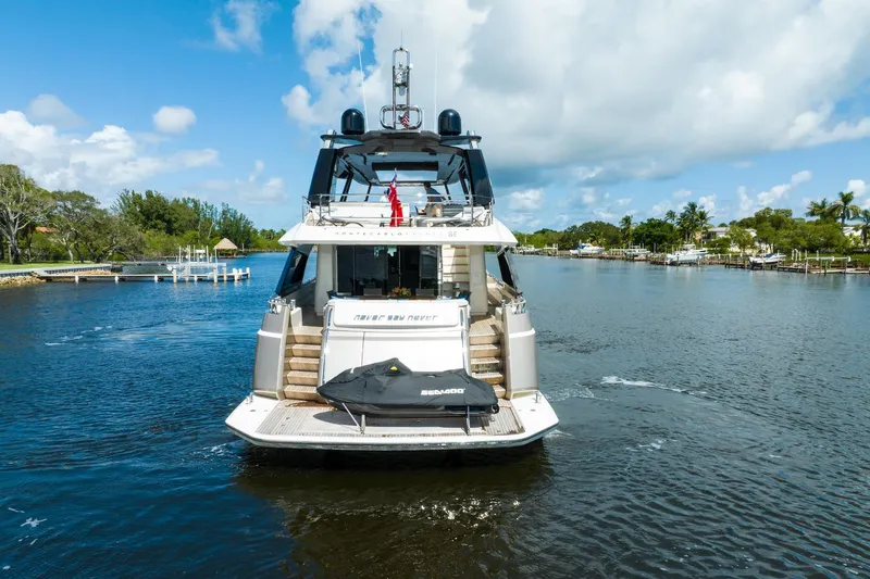 Slide: The Image of Luxury Monte Carlo Yachts MCY 86 cruising on a scenic waterway, 2015 model. - 5